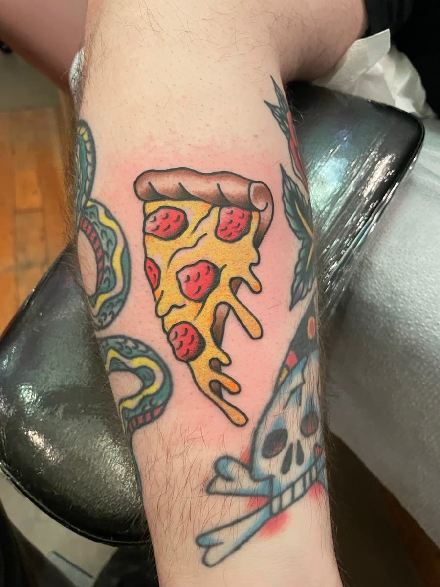 Colorful traditional American tattoo by Krystian Schneider at Historic Tattoo Portland