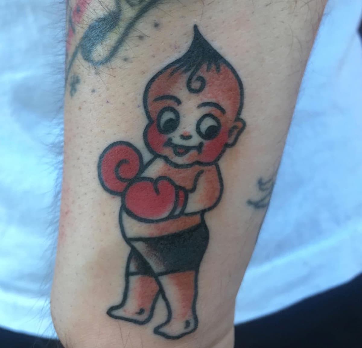 Traditional snake and skull tattoo by One Eyed Jon Portland